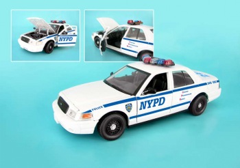 NYPD Patrol Car - This beautiful patrol car has front doors that open and a trunk that opens to reveal a donut.  This car is mounted on a NYPD platform. Makes an excellent gift for police afficianodo