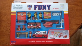 FDNY Gift Play set - FDNY play set has three firefighter figures, a helicopter, ambulance,fire truck. Also includes a fire extinguisher, cones, and do not cross signs